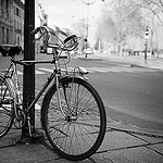 black and white picture of a bike on a rural street